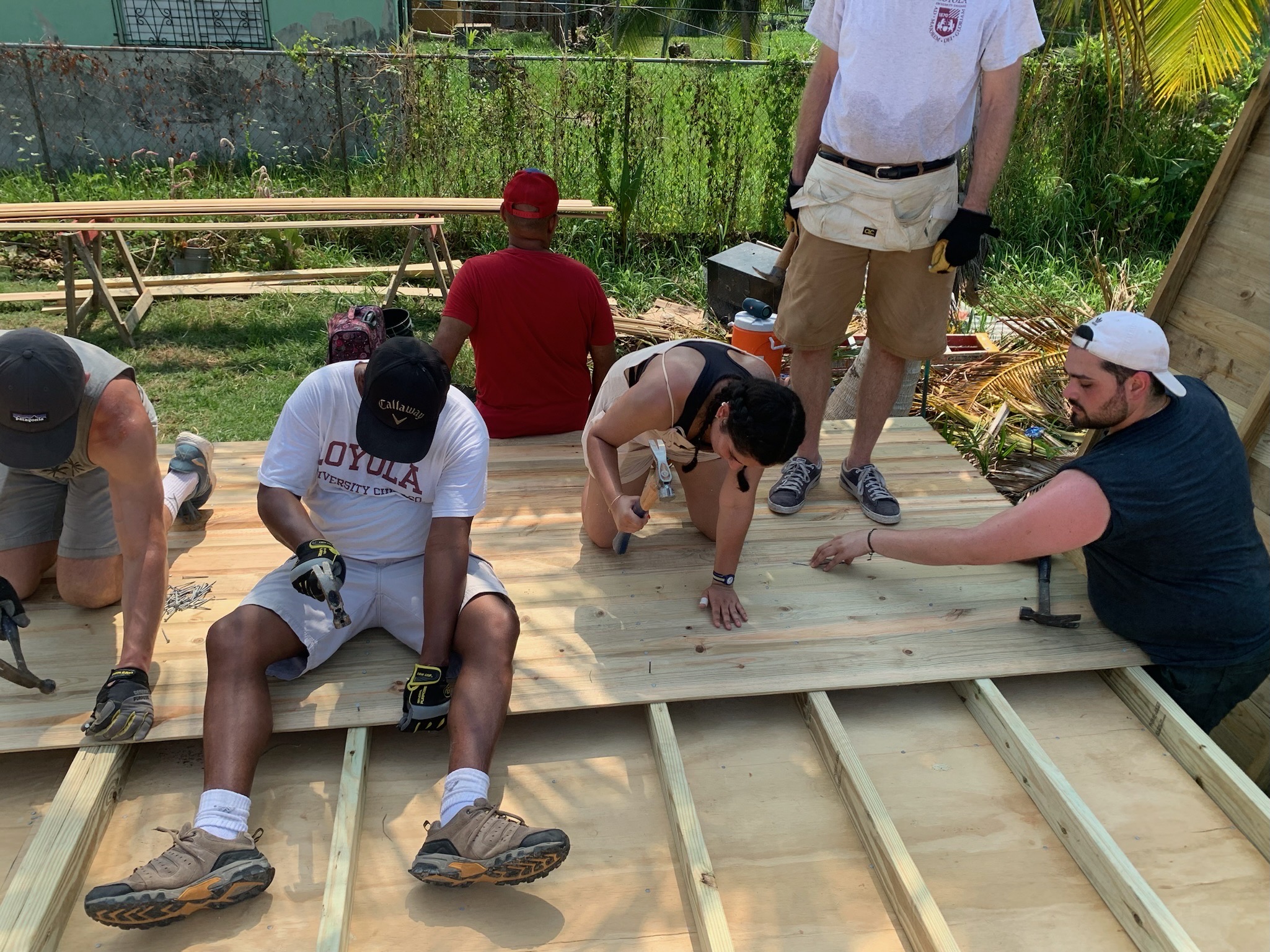 Students and staff building a house in Belize City